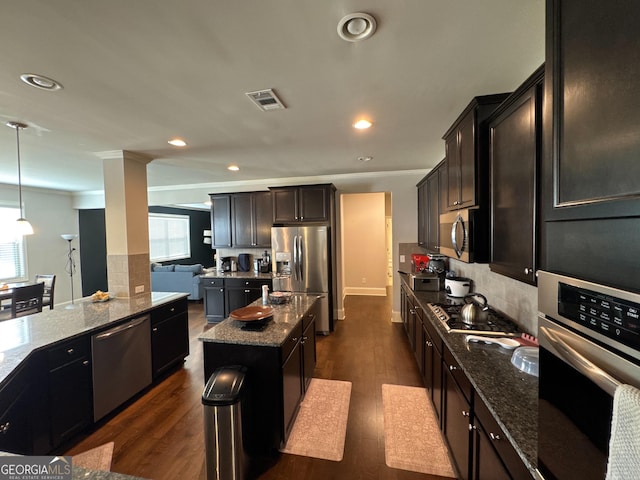 419 Woodmill Way SW, South Fulton, GA 30331 - kitchen with stainless steel appliances, a kitchen island, dark stone counters, recessed lighting, and dark wood finished floors