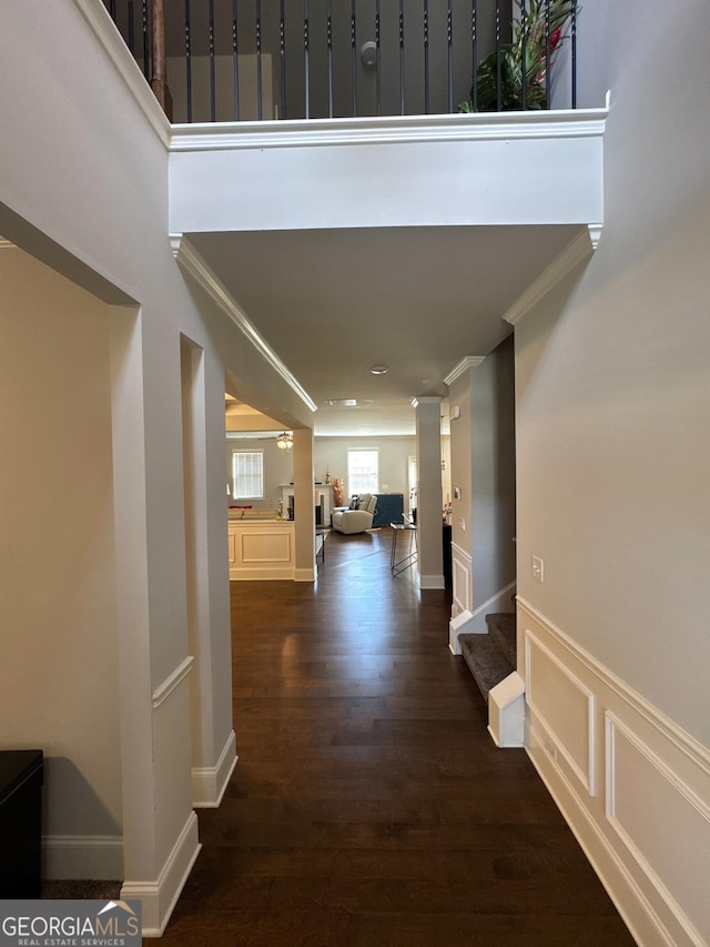 419 Woodmill Way SW, South Fulton, GA 30331 - corridor with ornamental molding, stairway, dark wood-type flooring, and ornate columns