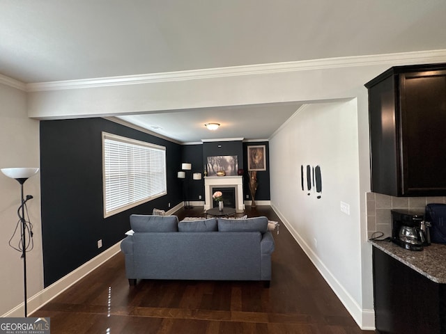 419 Woodmill Way SW, South Fulton, GA 30331 - living area featuring wood finished floors, baseboards, a fireplace, and crown molding