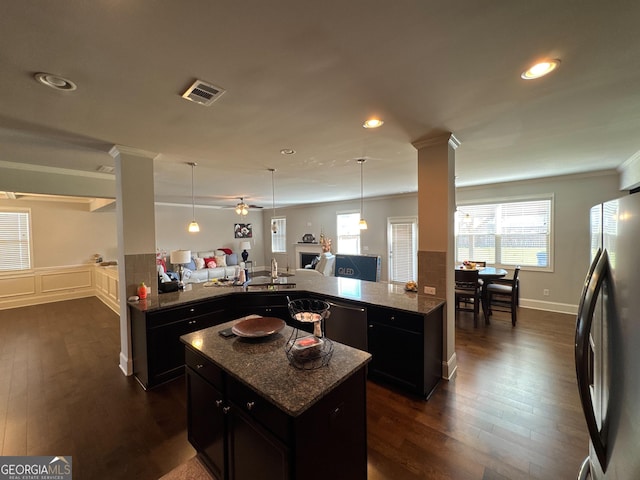 419 Woodmill Way SW, South Fulton, GA 30331 - kitchen with freestanding refrigerator, ornate columns, ornamental molding, open floor plan, and a peninsula