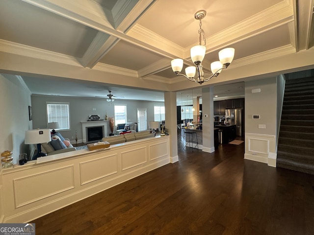 419 Woodmill Way SW, South Fulton, GA 30331 - living area with a chandelier, a fireplace, a ceiling fan, stairway, and dark wood-type flooring