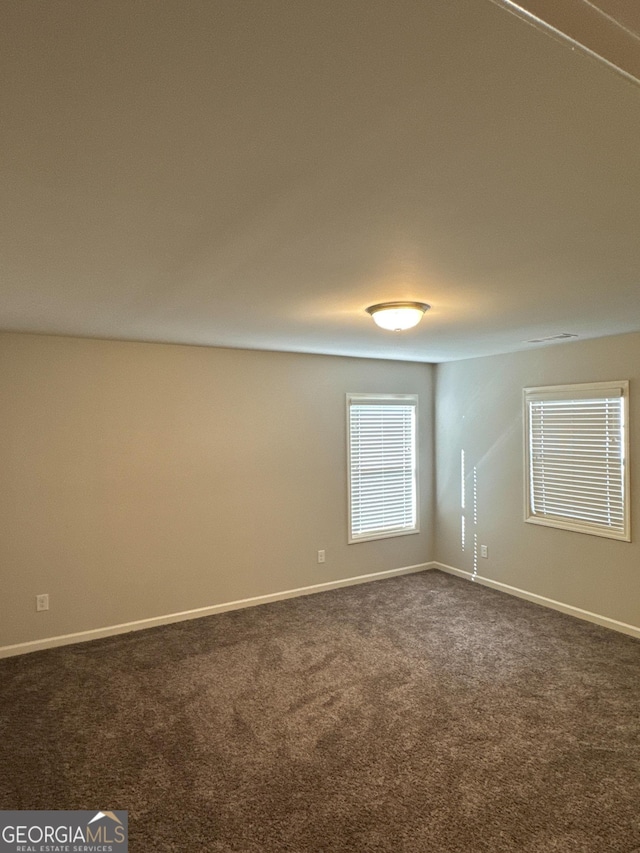 419 Woodmill Way SW, South Fulton, GA 30331 - empty room with dark carpet and baseboards