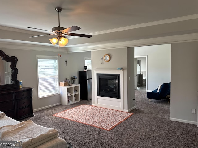419 Woodmill Way SW, South Fulton, GA 30331 - carpeted living room featuring a glass covered fireplace, ornamental molding, baseboards, and a ceiling fan