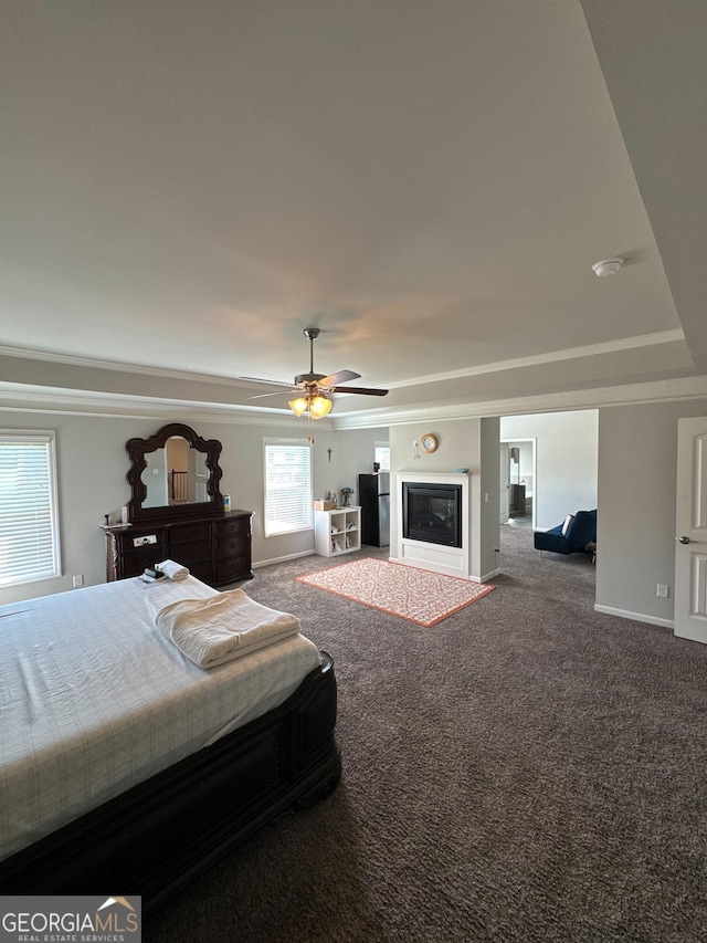 419 Woodmill Way SW, South Fulton, GA 30331 - bedroom with carpet, ornamental molding, baseboards, a glass covered fireplace, and ceiling fan