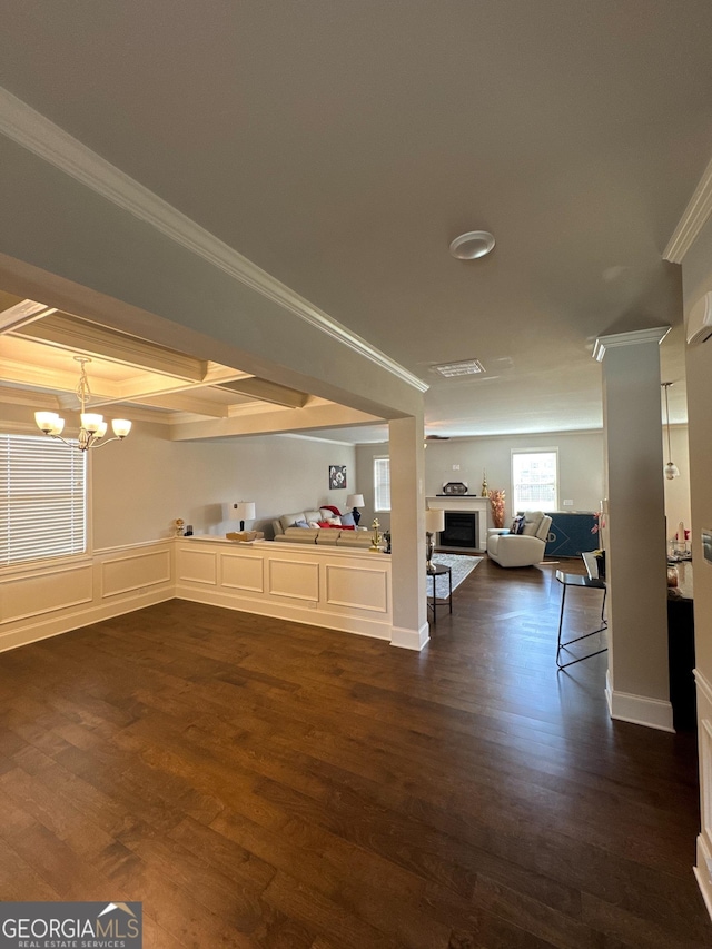 419 Woodmill Way SW, South Fulton, GA 30331 - living room featuring a chandelier, dark wood-type flooring, ornamental molding, and a fireplace