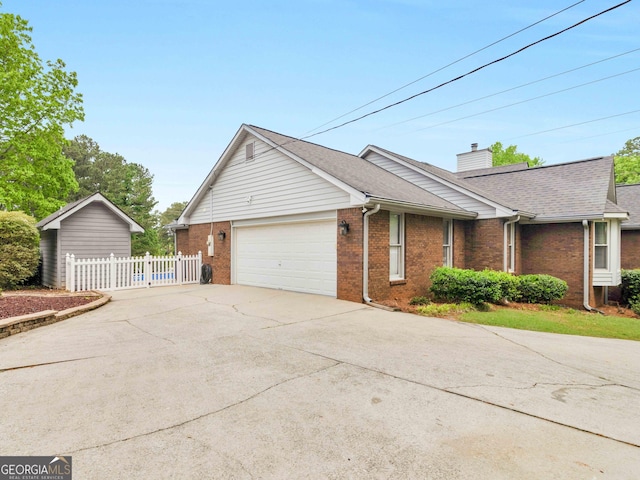 8117 Spivey Rd, Jonesboro, GA 30236 - view of property exterior featuring brick siding, an attached garage, driveway, and roof with shingles