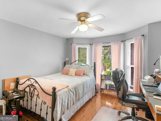 8117 Spivey Rd, Jonesboro, GA 30236 - bedroom featuring wood finished floors, a desk, and a ceiling fan