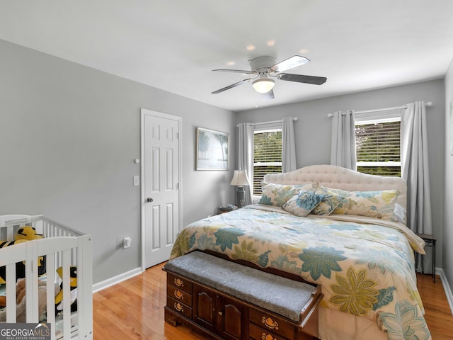 8117 Spivey Rd, Jonesboro, GA 30236 - bedroom featuring light wood finished floors, baseboards, and a ceiling fan