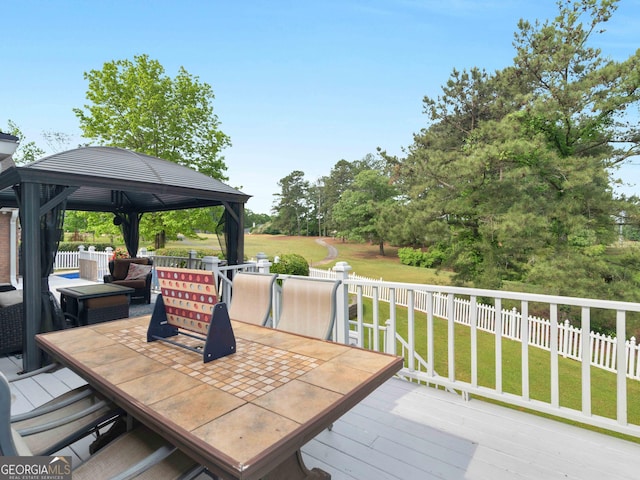 8117 Spivey Rd, Jonesboro, GA 30236 - wooden deck featuring outdoor dining space and a gazebo