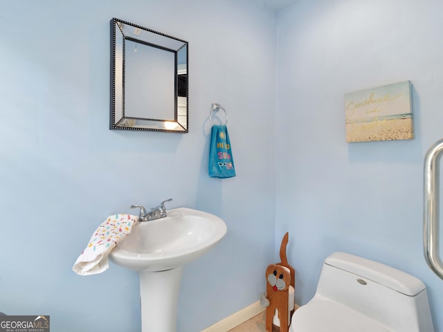 8117 Spivey Rd, Jonesboro, GA 30236 - half bathroom with toilet and baseboards