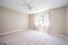 1202 Laurel Cliff Dr SE, Smyrna, GA 30082 - unfurnished room featuring baseboards and carpet