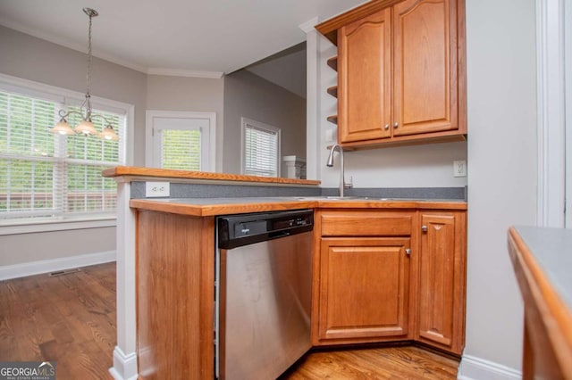 5995 Azalea Ridge Dr, Douglasville, GA 30135 - kitchen with stainless steel dishwasher, a sink, light wood-type flooring, baseboards, and decorative light fixtures