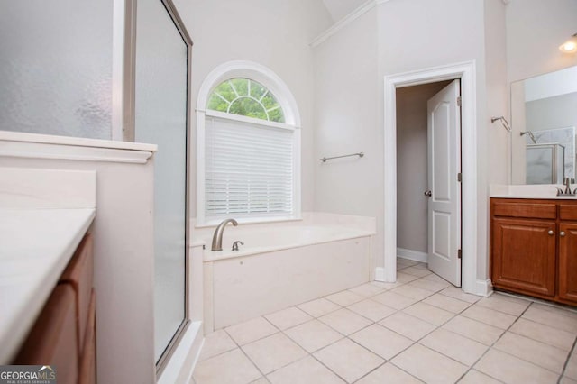5995 Azalea Ridge Dr, Douglasville, GA 30135 - full bathroom with vanity, a stall shower, tile patterned floors, a bath, and lofted ceiling