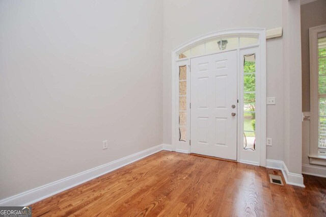 5995 Azalea Ridge Dr, Douglasville, GA 30135 - foyer entrance featuring wood finished floors and baseboards