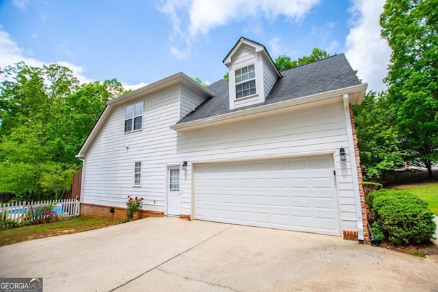 5995 Azalea Ridge Dr, Douglasville, GA 30135 - view of front of house featuring roof with shingles, driveway, a garage, and fence