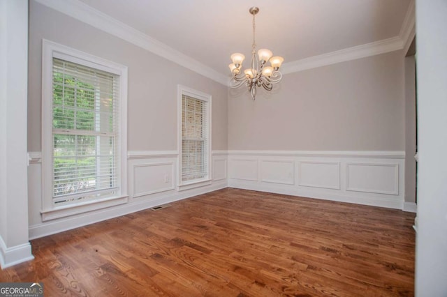 5995 Azalea Ridge Dr, Douglasville, GA 30135 - unfurnished room featuring a chandelier, crown molding, wood finished floors, and a wainscoted wall