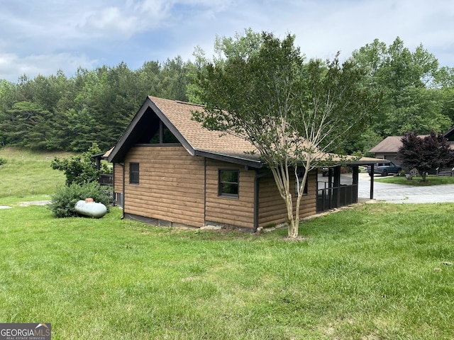 16 Tuts Mountain Rd, Clayton, GA 30525 - view of side of home featuring a yard and roof with shingles