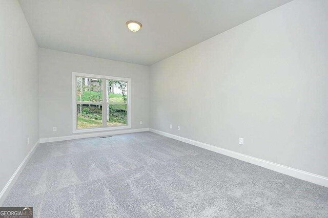 3018 Old Covington Rd Unit 3, Covington, GA 30014 - empty room featuring carpet floors and baseboards