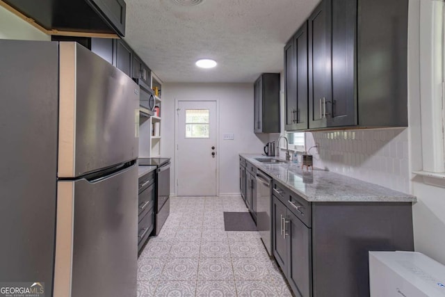 1902 Athens Hwy, Jefferson, GA 30549 - kitchen with appliances with stainless steel finishes, a textured ceiling, and light stone counters