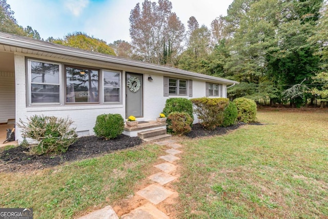 1902 Athens Hwy, Jefferson, GA 30549 - view of front of home with brick siding and a front lawn
