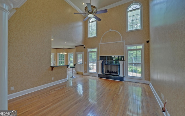 194 Winding Way, Hartwell, GA 30643 - unfurnished living room with hardwood / wood-style floors, ornamental molding, ceiling fan, a high ceiling, and baseboards