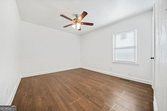 1831 Dresden Dr, Brookhaven, GA 30319 - empty room with a ceiling fan, dark wood-type flooring, and baseboards