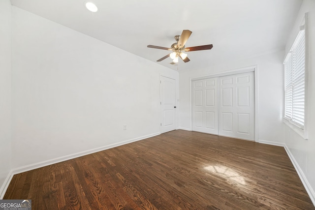 1831 Dresden Dr, Brookhaven, GA 30319 - unfurnished bedroom with dark wood-style flooring, baseboards, a closet, and a ceiling fan