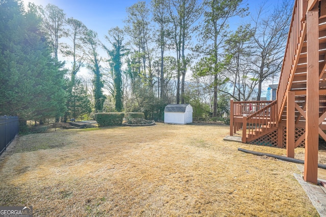 1831 Dresden Dr, Brookhaven, GA 30319 - view of yard featuring stairs, a storage unit, an outbuilding, and fence