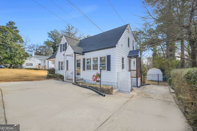 1831 Dresden Dr, Brookhaven, GA 30319 - view of front of home with roof with shingles, a gate, fence, and concrete driveway