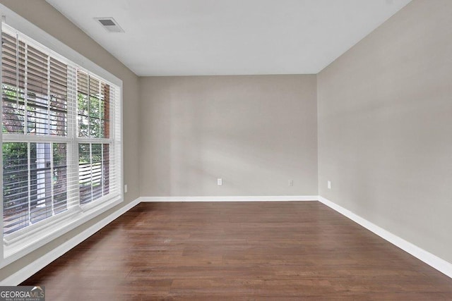 1280 Chandler Ridge Dr, Lawrenceville, GA 30045 - empty room with baseboards and dark wood finished floors