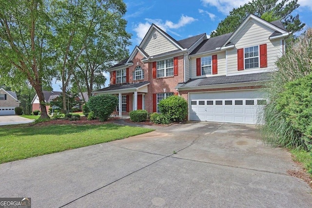 1280 Chandler Ridge Dr, Lawrenceville, GA 30045 - view of front of home featuring concrete driveway, an attached garage, a front lawn, and brick siding