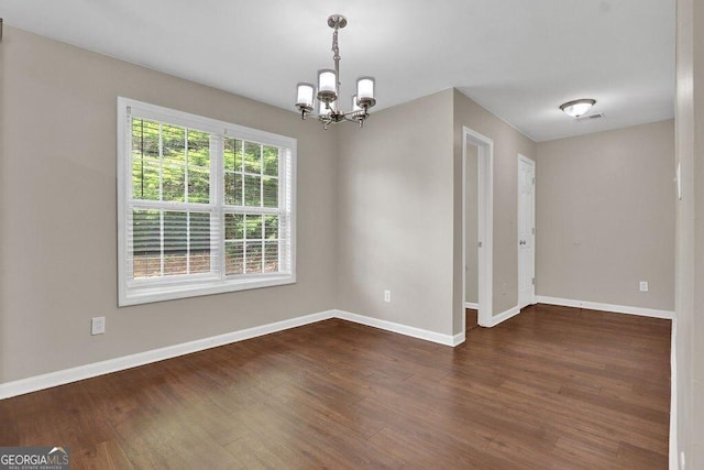 1280 Chandler Ridge Dr, Lawrenceville, GA 30045 - spare room featuring a chandelier and wood finished floors
