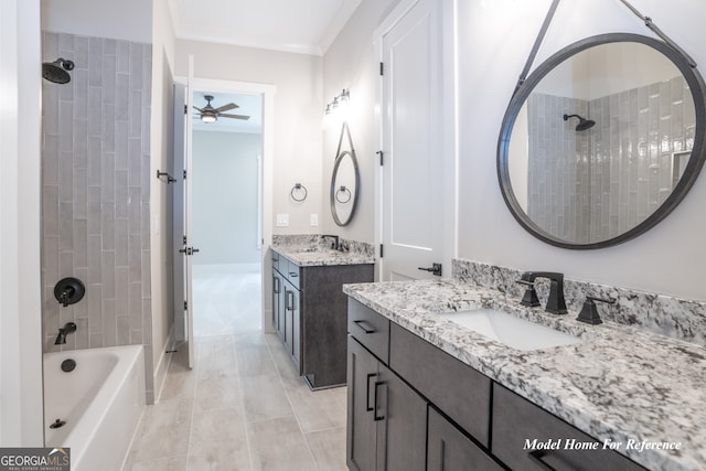 bathroom with ceiling fan, two vanities, bathing tub / shower combination, and crown molding
