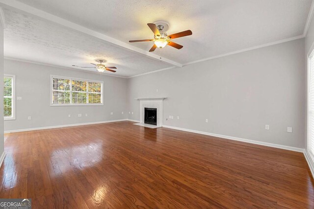 7165 Jonsway, Cumming, GA 30041 - unfurnished living room featuring a ceiling fan, wood finished floors, a fireplace with flush hearth, baseboards, and a textured ceiling