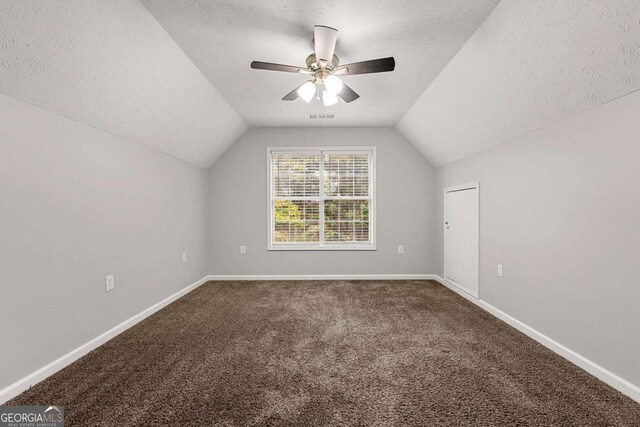 7165 Jonsway, Cumming, GA 30041 - bonus room with a textured ceiling, lofted ceiling, carpet flooring, a ceiling fan, and baseboards