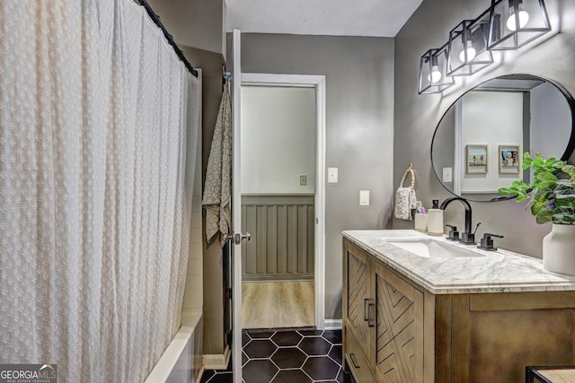 124 Laurel Dr, Barnesville, GA 30204 - full bath featuring tile patterned floors, vanity, and shower / bath combination with curtain