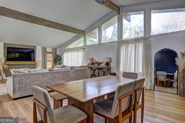 124 Laurel Dr, Barnesville, GA 30204 - dining area with beamed ceiling, high vaulted ceiling, and light wood-type flooring