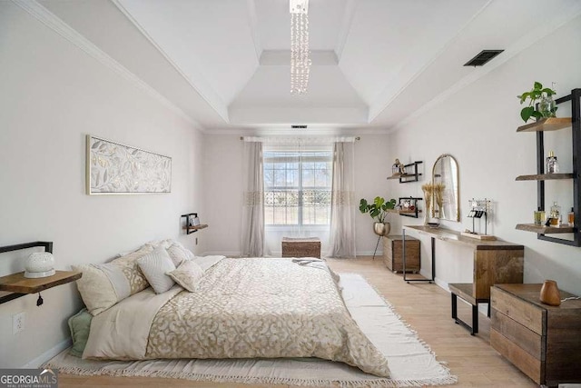 128 Graybrook Ct, Grayson, GA 30017 - bedroom featuring a tray ceiling and light wood finished floors