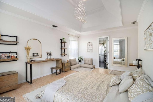 128 Graybrook Ct, Grayson, GA 30017 - bedroom with wood finished floors, a raised ceiling, and ornamental molding