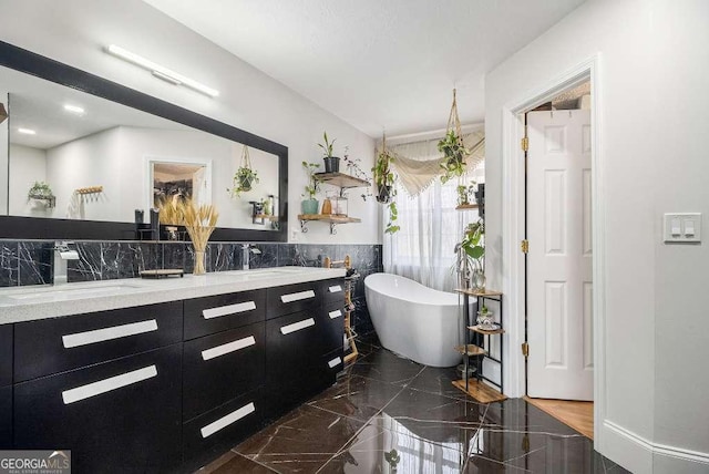 128 Graybrook Ct, Grayson, GA 30017 - full bathroom with a soaking tub, double vanity, and marble tiled flooring