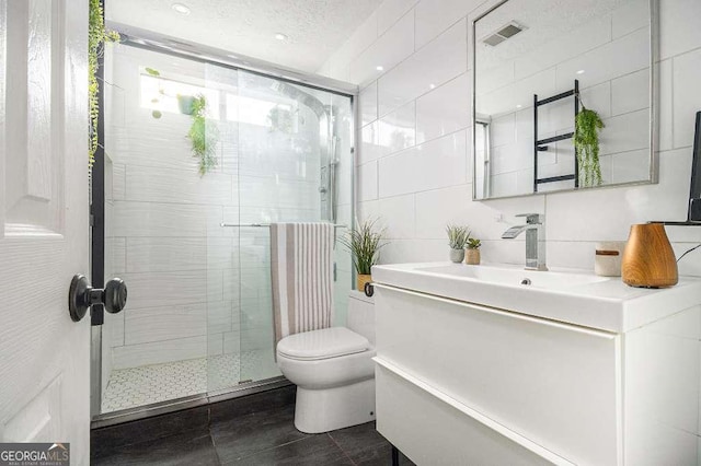 128 Graybrook Ct, Grayson, GA 30017 - full bathroom with tile walls, a shower stall, toilet, and vanity