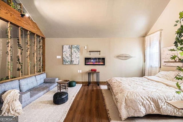 128 Graybrook Ct, Grayson, GA 30017 - bedroom with wood finished floors, lofted ceiling, and baseboards