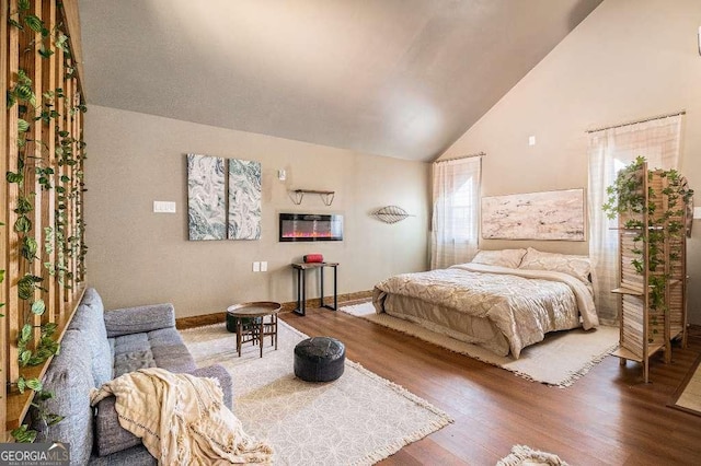 128 Graybrook Ct, Grayson, GA 30017 - bedroom featuring wood finished floors and high vaulted ceiling