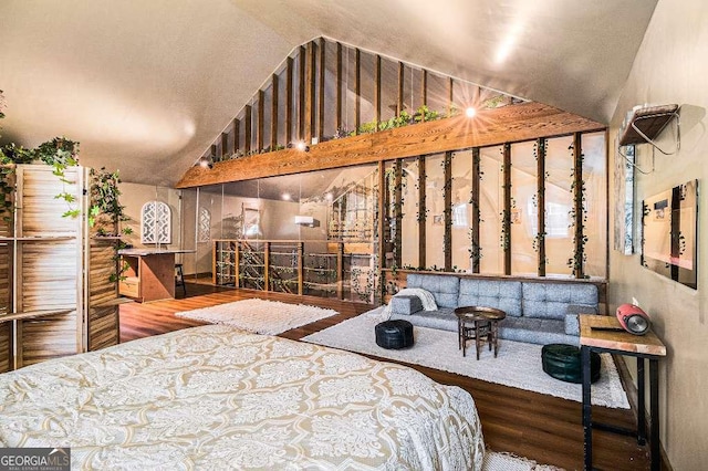 128 Graybrook Ct, Grayson, GA 30017 - bedroom with wood finished floors and high vaulted ceiling