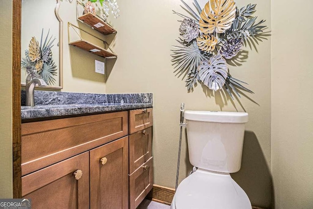 128 Graybrook Ct, Grayson, GA 30017 - half bathroom featuring toilet and vanity