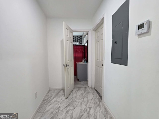4255 Worsham Ave, Macon, GA 31206 - hallway featuring electric panel, light marble finish floors, and baseboards