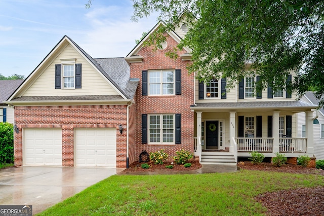 138 Knightwood Pt, Acworth, GA 30101 - view of front of house with a porch, driveway, brick siding, and a front lawn