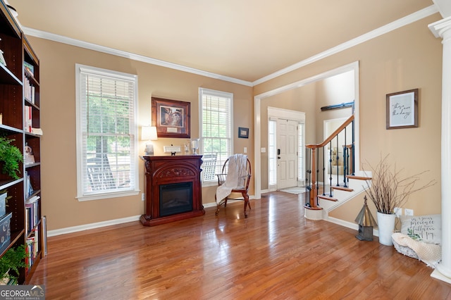 138 Knightwood Pt, Acworth, GA 30101 - foyer entrance with stairs, wood finished floors, ornamental molding, baseboards, and a glass covered fireplace