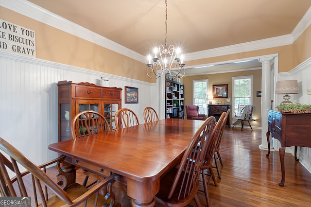 138 Knightwood Pt, Acworth, GA 30101 - dining room featuring ornamental molding, wood finished floors, a chandelier, and decorative columns