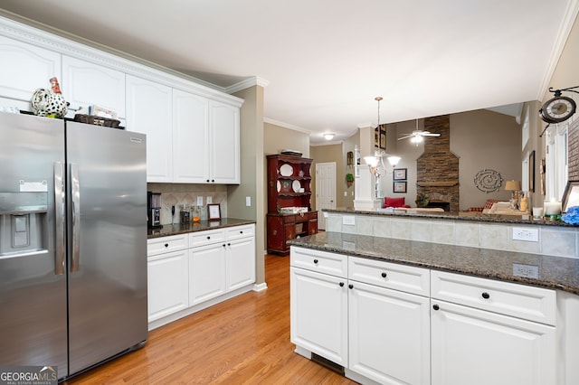138 Knightwood Pt, Acworth, GA 30101 - kitchen with stainless steel fridge, backsplash, light wood-style floors, a ceiling fan, and white cabinets